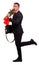 A guy is standing on one leg and sniffing roses on a white isolated background