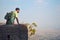 A Guy Standing On The Turret Of A Indian Fort and Looking at the Mountain Range Of Sahyadri