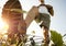 Guy walking through countryside in warm summer morning.