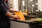 Guy washing dirty dishes in kitchen sink