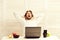 Guy yawns and sits near laptop and fruit. Home office