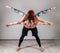 Guy and young woman doing strength exercises in yoga assanes. Acroyoga concept