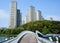 Gwangkyo, South Korea - April 29, 2018 : A bridge over a lake leading to a hill in the Gwangkyo Lake Park and nearby apartments in