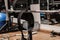 A gym with a lifting dumbbell bar and a lifting belt. sports, lifting equipment;