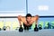 Gym man push-up strength pushup with Kettlebell