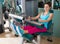 Gym seated leg curl machine exercise woman