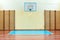 Gym for sports classes at school or College. Swedish wall, stairs, and wooden floor with markings for volleyball