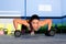 Gym woman push-up strength pushup with dumbbell