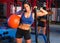 Gym woman with weighted ball and rope