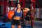 Gym woman with weighted ball and rope