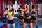 Gym women with barbell and kettlebell workout