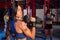 Gym women with hex barbell workout