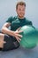 Gym workout with medicine ball exercise man
