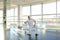 Gymnast in sportswear training near ballet barre in sport gym