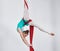 Gymnastics, aerial acrobat and a woman in air for silk performance, sports and balance. Athlete person, gymnast or