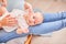 Gymnastics baby. woman doing exercises with baby for its development. massage a small newborn baby