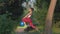 Gymnastics in nature, active beautiful female performing stretching exercise during fitness workout outdoors on wooden