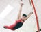 Gymnastics, ring and fitness with man in stadium and focus for sports, workout or health. Wellness, exercise and