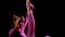 Gymnastics - young pretty plastic woman raising up her leg showing up her stretching - red neon lighting