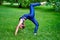 Gymnastics. Young woman practicing yoga meditation in nature a park. Health lifestyle concept