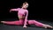 Gymnastics - young woman sits in splits and bending to the sides