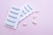 Gynecological medicines for women& x27;s health in form of suppository, capsules on pink background.