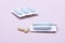 Gynecological medicines for women& x27;s health in form of suppository, capsules on pink background.