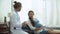 gynecologist doctor examining and consulting to pregnant woman in medical office at at hospital