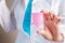 Gynecologist holding menstrual cup