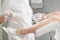 Gynecologist holding speculum in clinic before patient examination