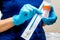 Gynecologist holds a brush for sampling liquid cytology