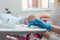 A gynecologist performs an ultrasound diagnostic procedure for a girl lying in a gynecological chair. Pregnancy