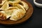 Gyoza Chinese Dumplings on Wood Plate, Fried Vegetable Jiaozi Macro, Chicken Momo Pile, Asian Gyoza Closeup