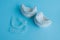 Gypsum jaws models with silicone invisible aligners on a blue background.