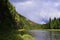 The gypsum megaliths of the Usva Pillars rocks, overgrown with forest, hang over the Usva River