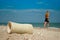 Gypsum shot, girl sand close up against the sea and sky, clouds broken arm limb, recovery, girl leaves