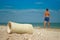 Gypsum shot, man sand close up against the sea and sky, clouds broken arm limb, recovery, the guy leaves