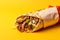 Gyros tasty fast food street food for take away on yellow background