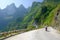 Ha Giang / Vietnam - 01/11/2017: Motorbiking backpackers on winding roads through valleys and karst mountain scenery in the North