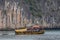 HA LONG BAY, VIETNAM - NOVEMBER 13, 2018: Halong Bay, Vietnam. Unesco World Heritage Site. Traditional tourist boats