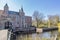Haamstede in Schouwen-Duiveland, Zeeland, Netherlands. April 26, 2021. Pedestrian bridge, the moat and the old castle of Haamstede