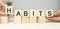 HABITS word written on building blocks