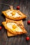 Hachapuri Adjara. Beautiful open pies khachapuri with egg on wooden