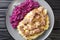 Hachee based on beef, onions, potatoes, red cabbage is a typical example of traditional Dutch cuisine closeup in the plate.