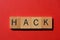 Hack, single word on red