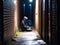 Hacker in hooded silhouette alleyway