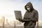 Hacker man with anonymous mask using laptop to hacking