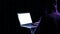 Hacker security cyber attack. Digital laptop in hacker man hand isolated on black. Internet web hack technology. Login