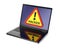 Hacker warning sign on laptop screen.