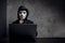 Hacker wearing a white mask in front of his computer. hacker hacks network, Space for text